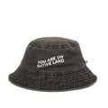 'YOU ARE ON NATIVE LAND' BUCKET HAT